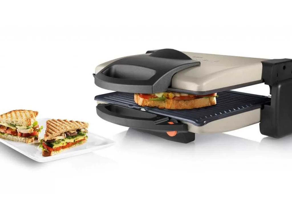 Зображення товару Гриль Bosch 1800Вт.,закр.нагр.елем.,знімні пласт.,антиприг.покриття.,отвори для відв.жиру,світл.індик.,,плавний рег.темп.,відкриття кришк.на 180° TFB3302V1